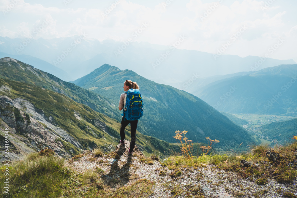  young woman hiking in the mountains of Georgia, Caucasus mountain