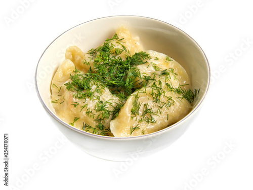 Dumplings, filled with cabbage in a plate, isolated on white background.