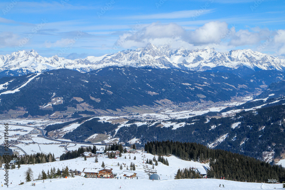 A picture from the ski resort in the austrian Alps. Snow and weather are perfect, slopes are empty. Skiing is passion in these conditions. The mountains around are great visible. 