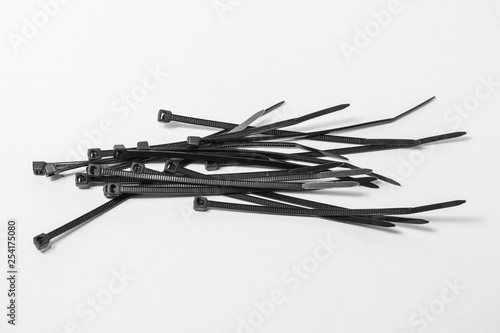 The bunch of black nylon ties. Plastic screeds.