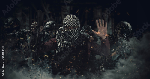 special forces police are capturing the insurgent photo