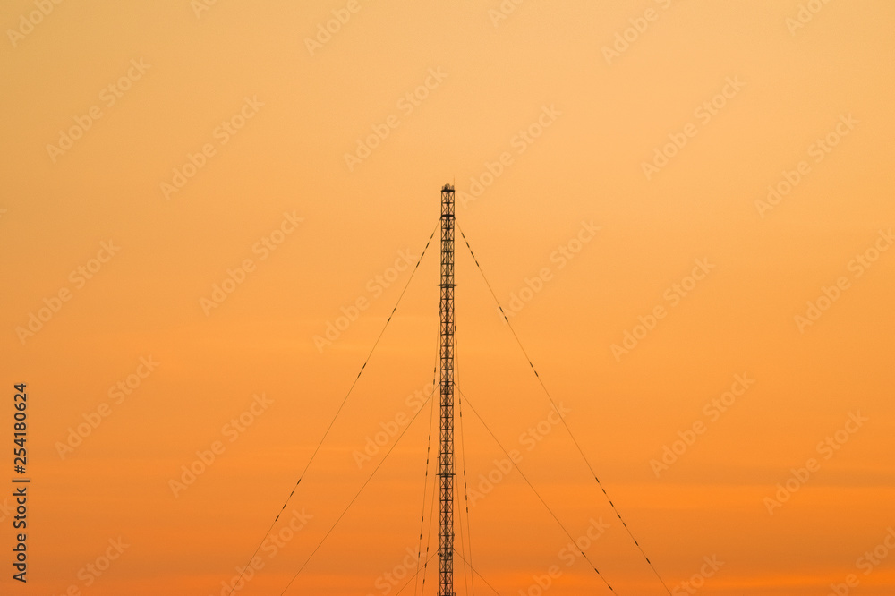 Guyed radio mast and sunset sky Stock Photo Adobe Stock