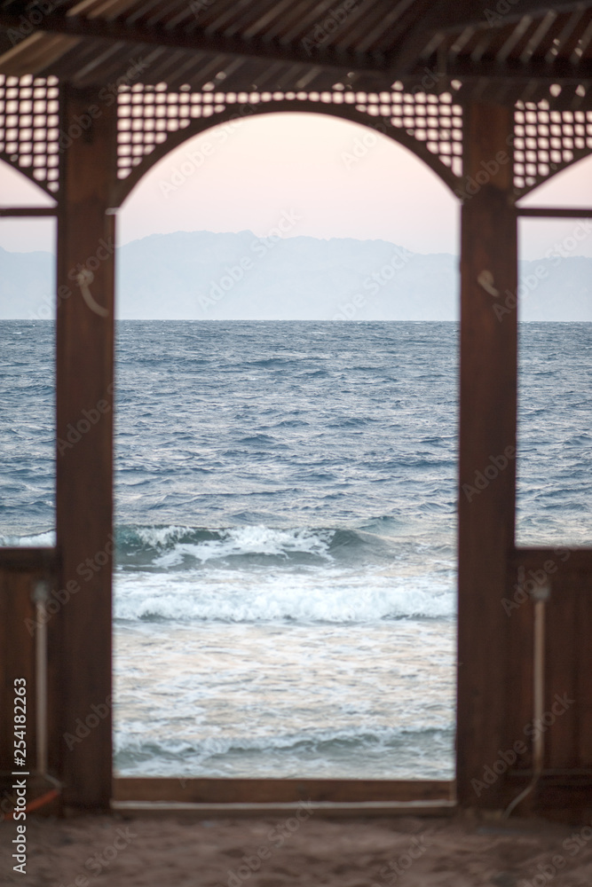 View from the gazebo on the sea on the Gulf of Aqaba and Saudi Arabia behind him
