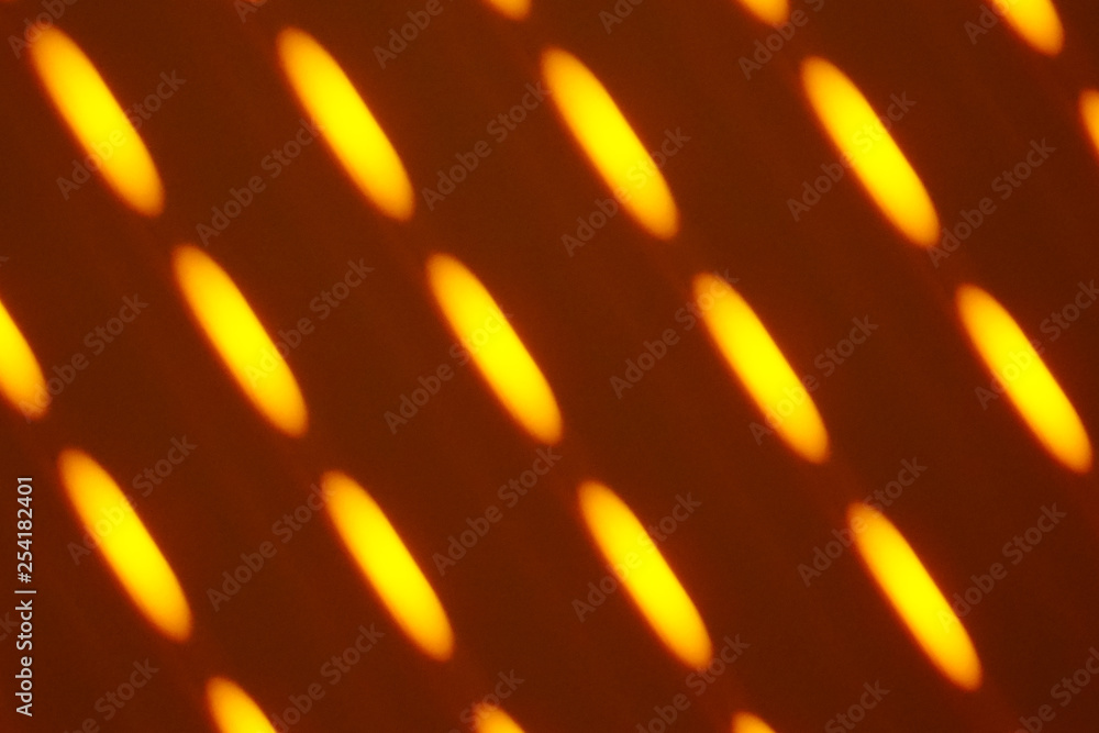 yellow light pattern on a wall yellow light pattern on a wall