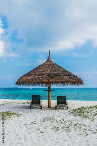 Lying on the white sandy beach of the Maldives overlooking the turquoise sea