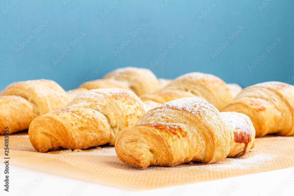Fragrant and delicious French croissants on the kitchen table Fragrant and delicious French croissants on the kitchen table