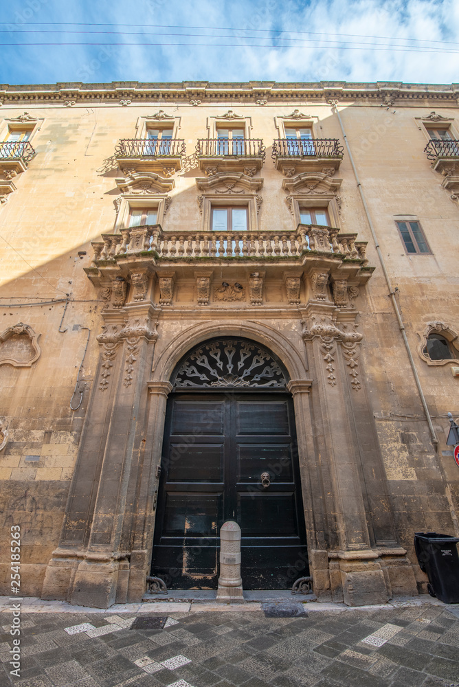 Lecce, Puglia, Italy - Medieval historical center in the old town. View and detail of an ancient gate or door. A region of Apulia