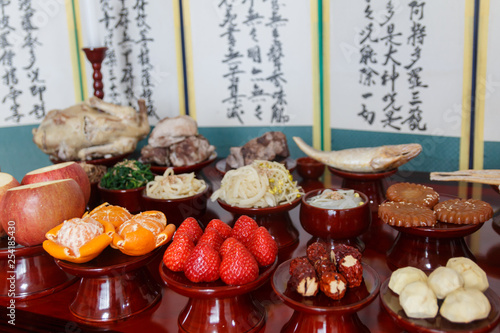 Table setting with various fruits and foods for Korean traditional Holiday photo