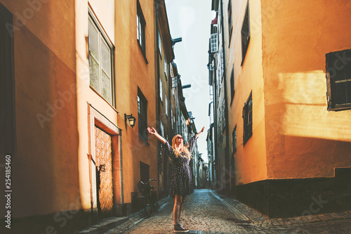 Photography Tourist woman walking in Stockholm enjoying old streets view traveling lifestyle