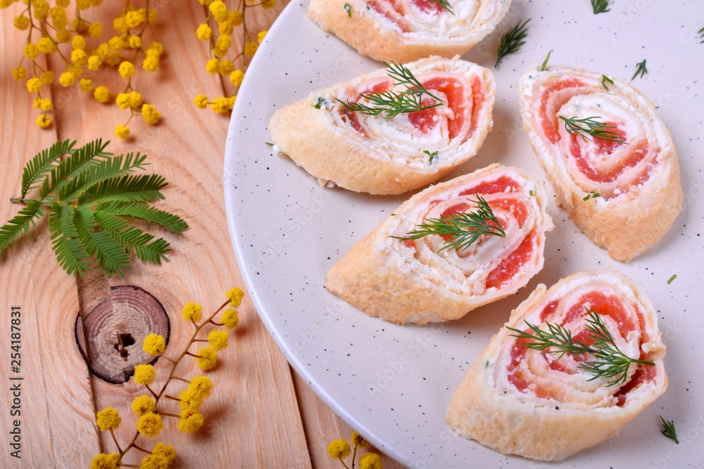 Crepes rolls with cream cheese and salmon cut into pieces