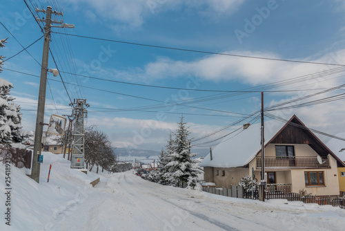 Road in Dubovica village in east Slovakia in snow frosty morning © luzkovyvagon.cz