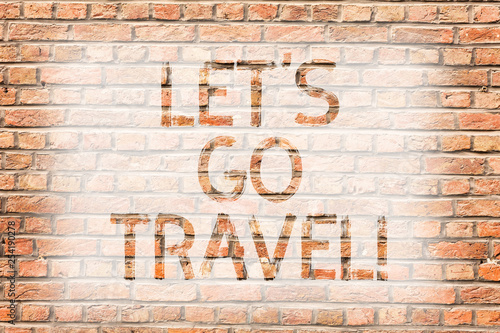 Text sign showing Let S Go Travel. Business photo text Going away Travelling Asking someone to go outside Trip Brick Wall art like Graffiti motivational call written on the wall