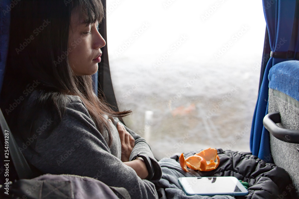A young woman ride in a bus. Asian girl sleep at public transport. A