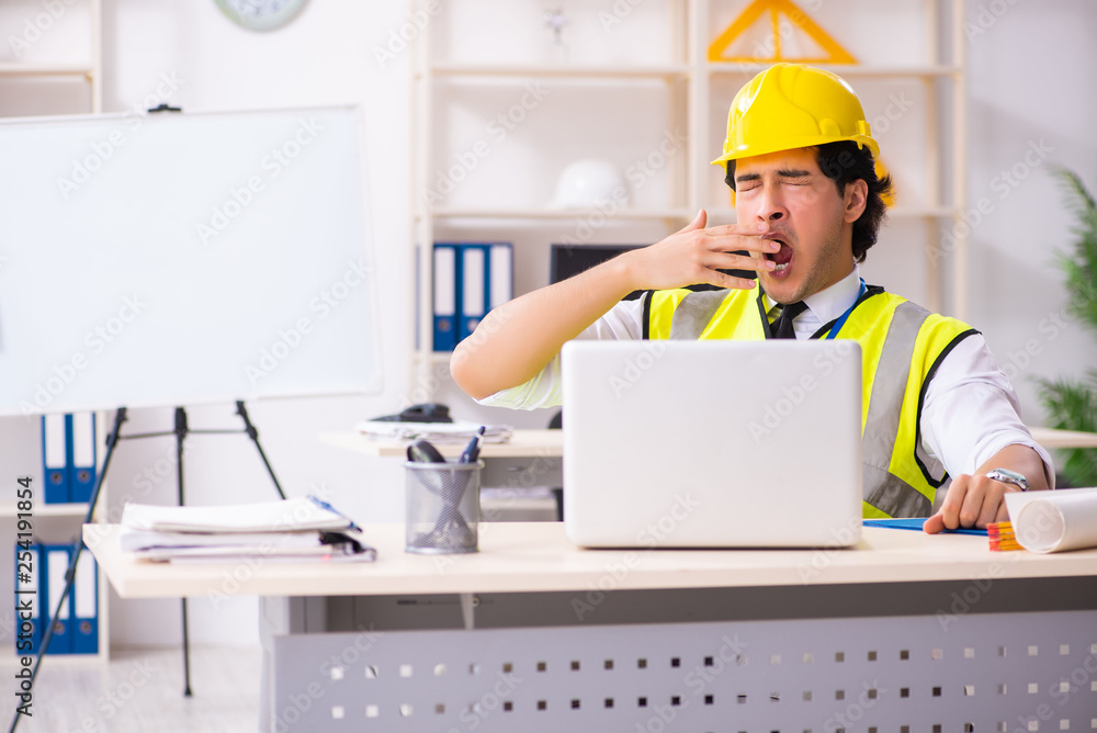 Male construction engineer working in the office Male construction engineer working in the office