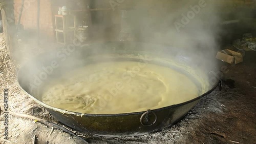 Sugar Cane Juice Boiling in the Container to Making Jaggery