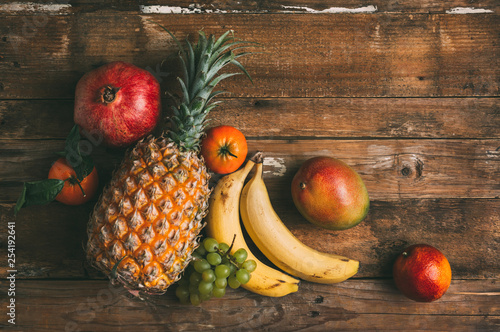 Ripe fruit on a wooden background