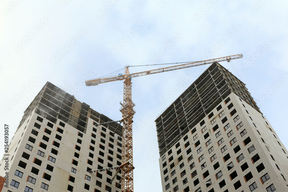 Capital construction of high-rise buildings with tower cranes at the construction site Capital construction of high-rise buildings with tower cranes at the construction site
