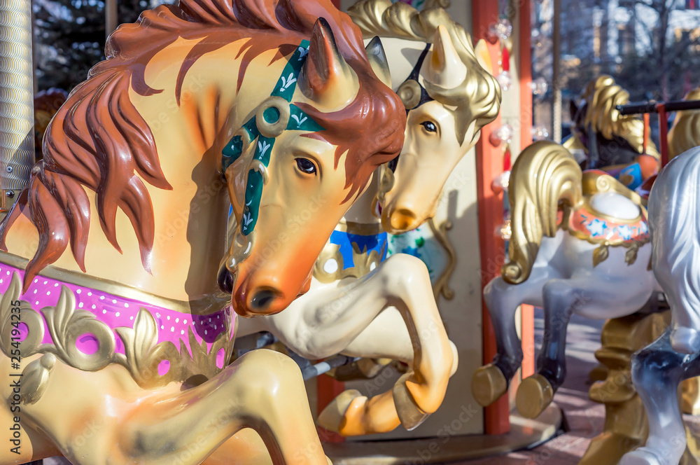 Horses on the old children's circular carousel.