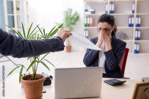 Young female employee being fired from her work