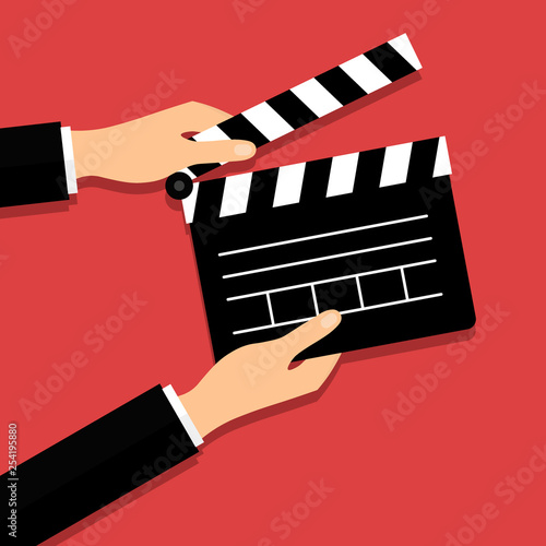 Black opened clapperboard in hands. Movie production clapper board. Cinematography concept. Vector illustration in modern flat style. EPS 10.
