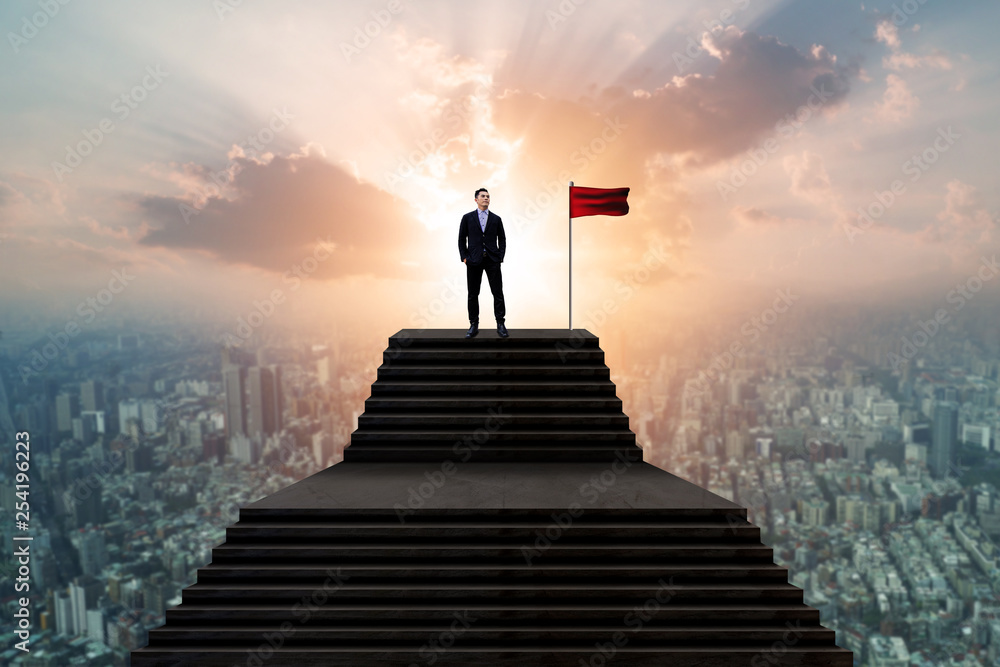 Success and effort man concept, business people in suit standing with winner flag and looking over cityscape view and thinking business plan of the future Success and effort man concept, business people in suit standing with winner flag and looking over cityscape view and thinking business plan of the future