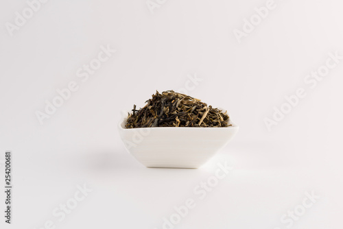 green tea in a bowl isolated on white background