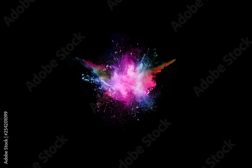 abstract colored dust explosion on a black background.abstract powder splatted background,Freeze motion of color powder exploding/throwing color powder, multicolored glitter texture.