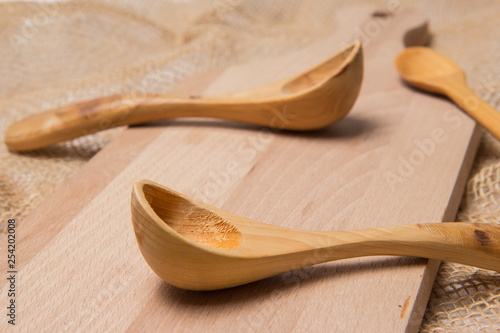 Spoons on cutting board close up