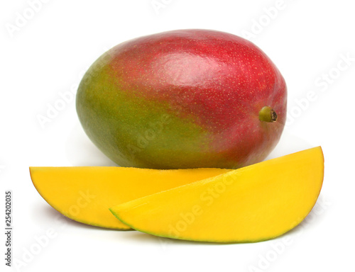 Mango fruit whole and slice isolated on a white background. Flat lay, top view