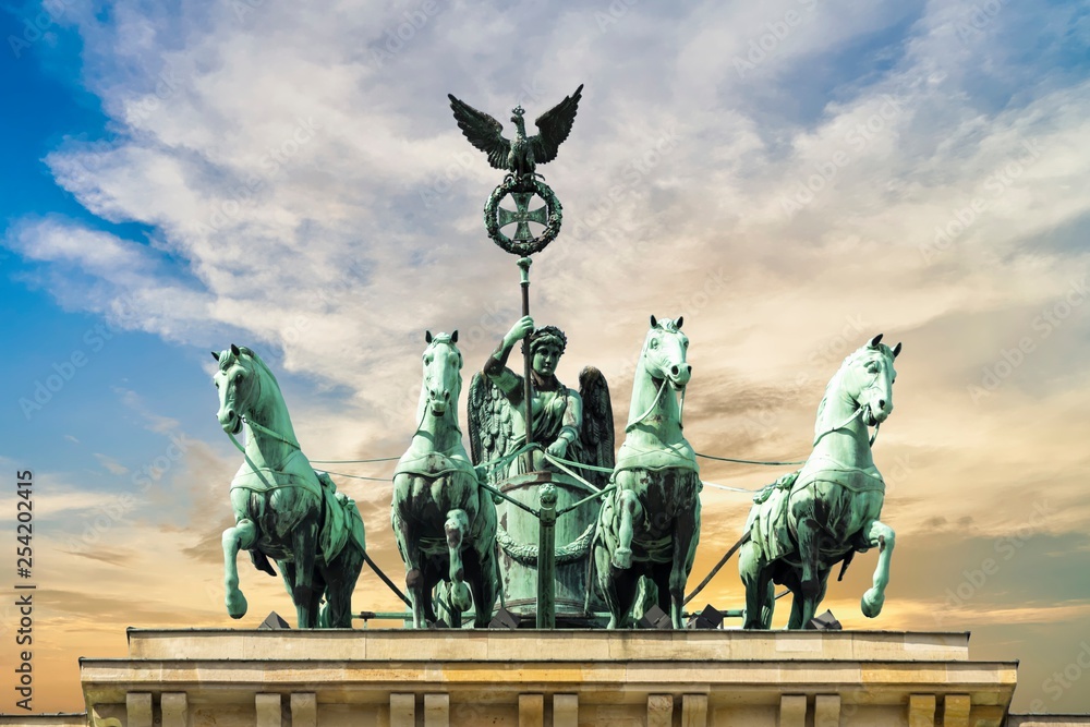 Fototapeta premium Brandenburg gate, blue cloudy sky, Berlin, Germany