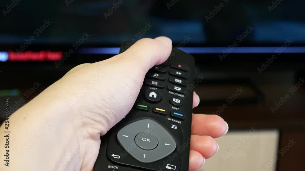 Remote from the TV in hand. Turn on the TV. Remote from the TV in hand. Turn on the TV.