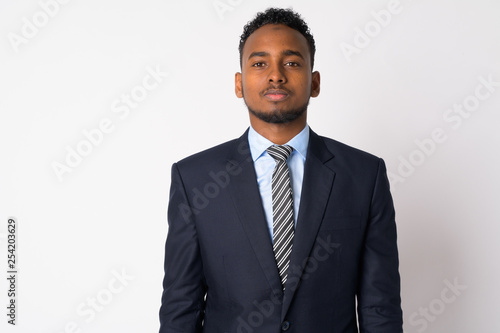 Portrait of young handsome African businessman in suit