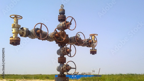 Bild auf Leinwand Equipment of an oil well. Shut off valves and service equipment