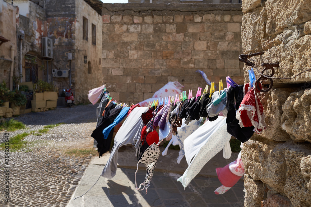 Linen is dried in the sun in the old part of the city of Rhodes Greece Linen is dried in the sun in the old part of the city of Rhodes Greece