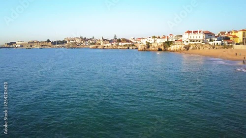 Wallpaper Mural Aerial, rising, drone shot, over the sea, bypassing Praia da Conceicao over Palacio Seixas, revealing the cityscape, on the coast of the Atlantic sea, in Cascais, Portugal Torontodigital.ca