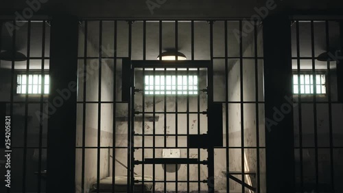 Animation of a grunge prison cell with landscape outside the barred-up window. photo