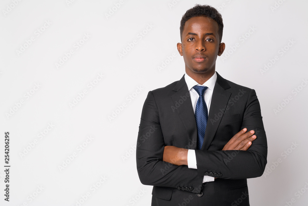 Portrait of young African businessman in suit with arms crossed Portrait of young African businessman in suit with arms crossed