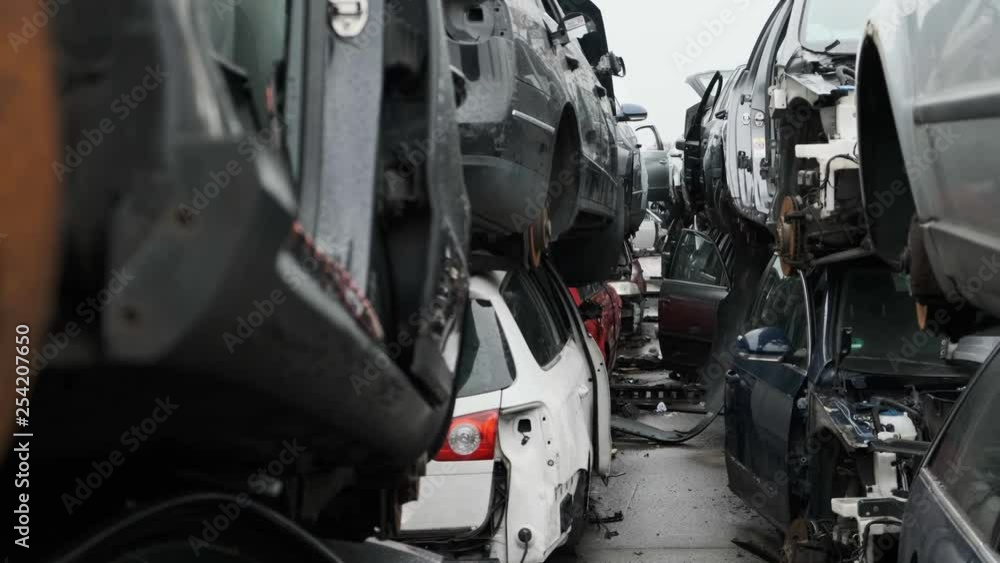 Scrapyard scene, walking through a tunnel of destroyed cars. Scrapyard scene, walking through a tunnel of destroyed cars.