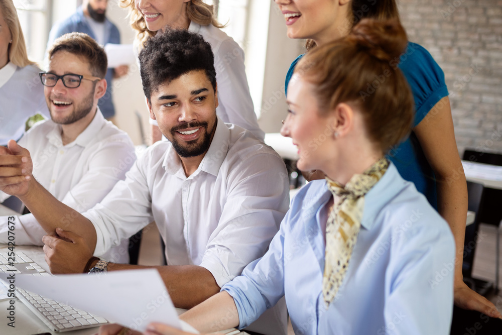 Group of young businesspeople or designers work with new startup project in office Group of young businesspeople or designers work with new startup project in office