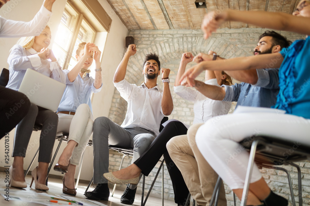 Business, startup, gesture, people and teamwork concept - happy creative team in office Business, startup, gesture, people and teamwork concept - happy creative team in office