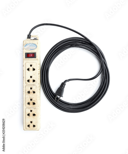 Old and not safe power strip with illuminated switch isolated on white background