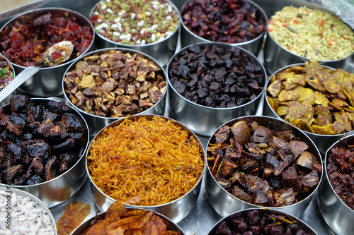 Different spices and herbs in metal bowls on a street market in Kolkata, West Bengal, India
