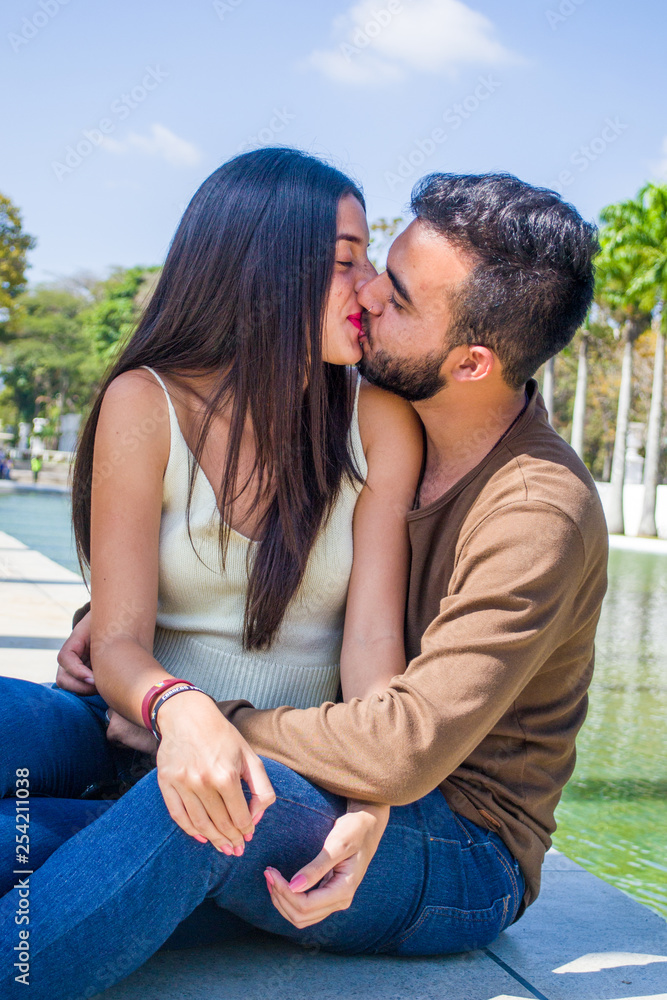 Cute couple hanging out in a park Cute couple hanging out in a park