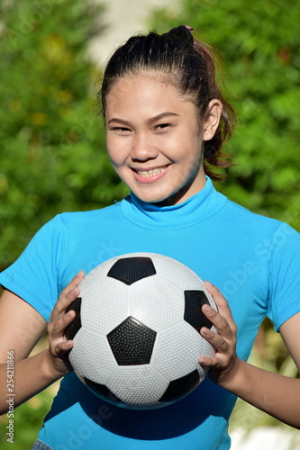 Portrait Of A Fitness Minority Female Soccer Player With Soccer Ball © dtiberio