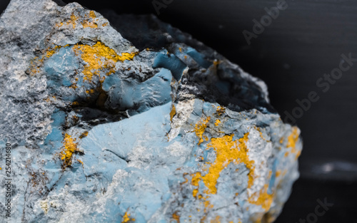 Background or texture from a stone in a section with a blue and yellow core. Natural and solid material. Minerals.