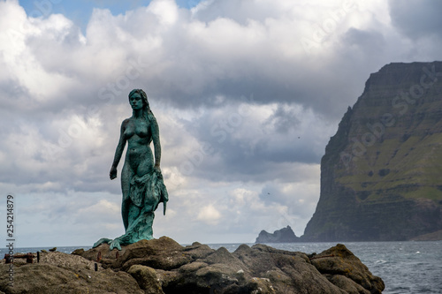 Fotografie Statue of Kopakonan (seal woman) in the village of Mikladalur, Kalsoy, Faroe Isl