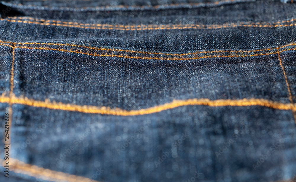 Back pocket of blue denim jeans Back pocket of blue denim jeans