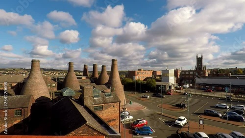 Aerial footage, view of the famous bottle kilns at Gladstone Pottery Museum in Stoke on Trent, Pottery manufacturing, industrial decline and vacant businesses photo