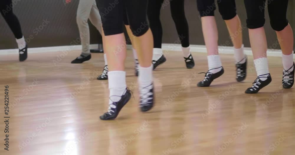 St. Patrick's Day celebration with dancers tap dancing to Irish traditional steps in the studio
(medium shot) St. Patrick's Day celebration with dancers tap dancing to Irish traditional steps in the studio
(medium shot)