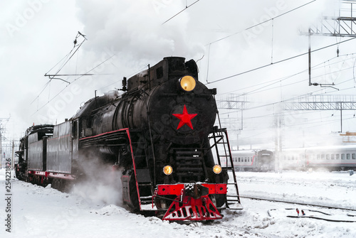 steam locomotive at the station in winter